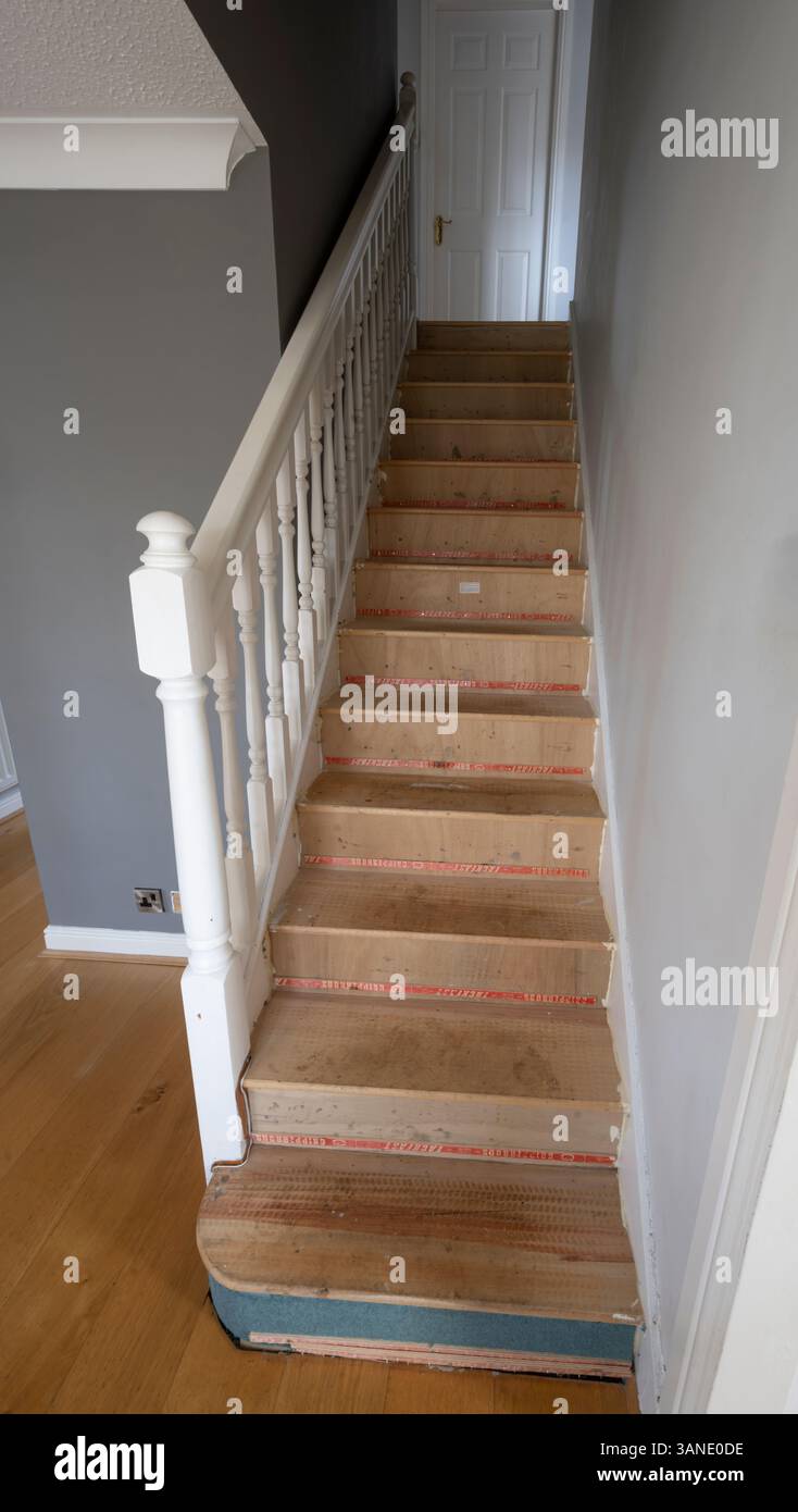 Home renovation project to remove wooden staircase and replace with contemporary steel fabricated structure, decoration and new carpet. Stock Photo