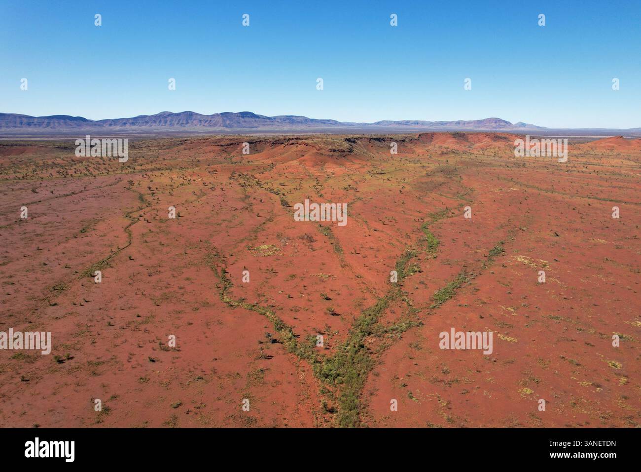 Aerial view of arid and rugged landscape with red earth and vast open space, Karijini National Park, Australia. Stock Photo