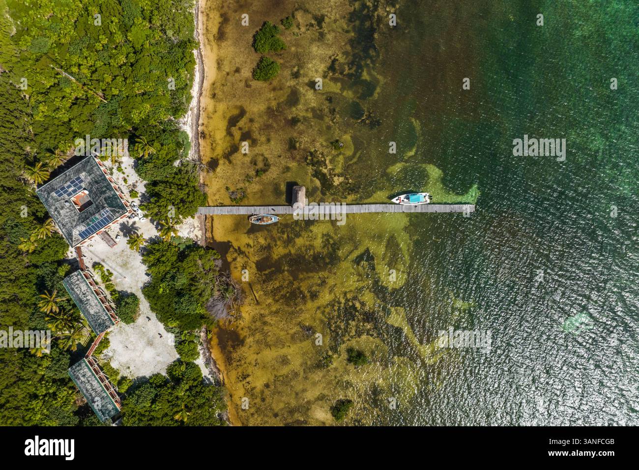 Aerial view of boats anchored at small pier on Cayo Centro small island ...