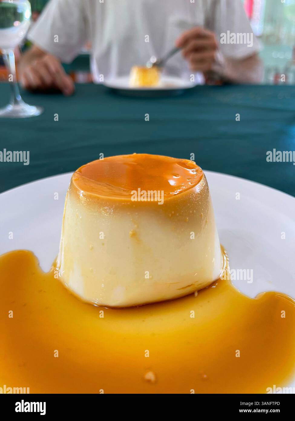 Eating cheese creme caramel. - Smartphone Captured Stock Image