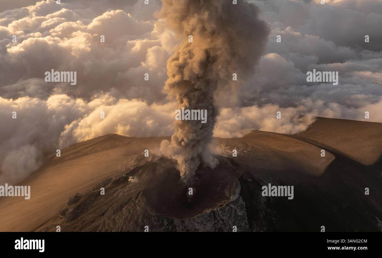 Aerial view of erupting Fuego volcano with smoke plume and crater ...