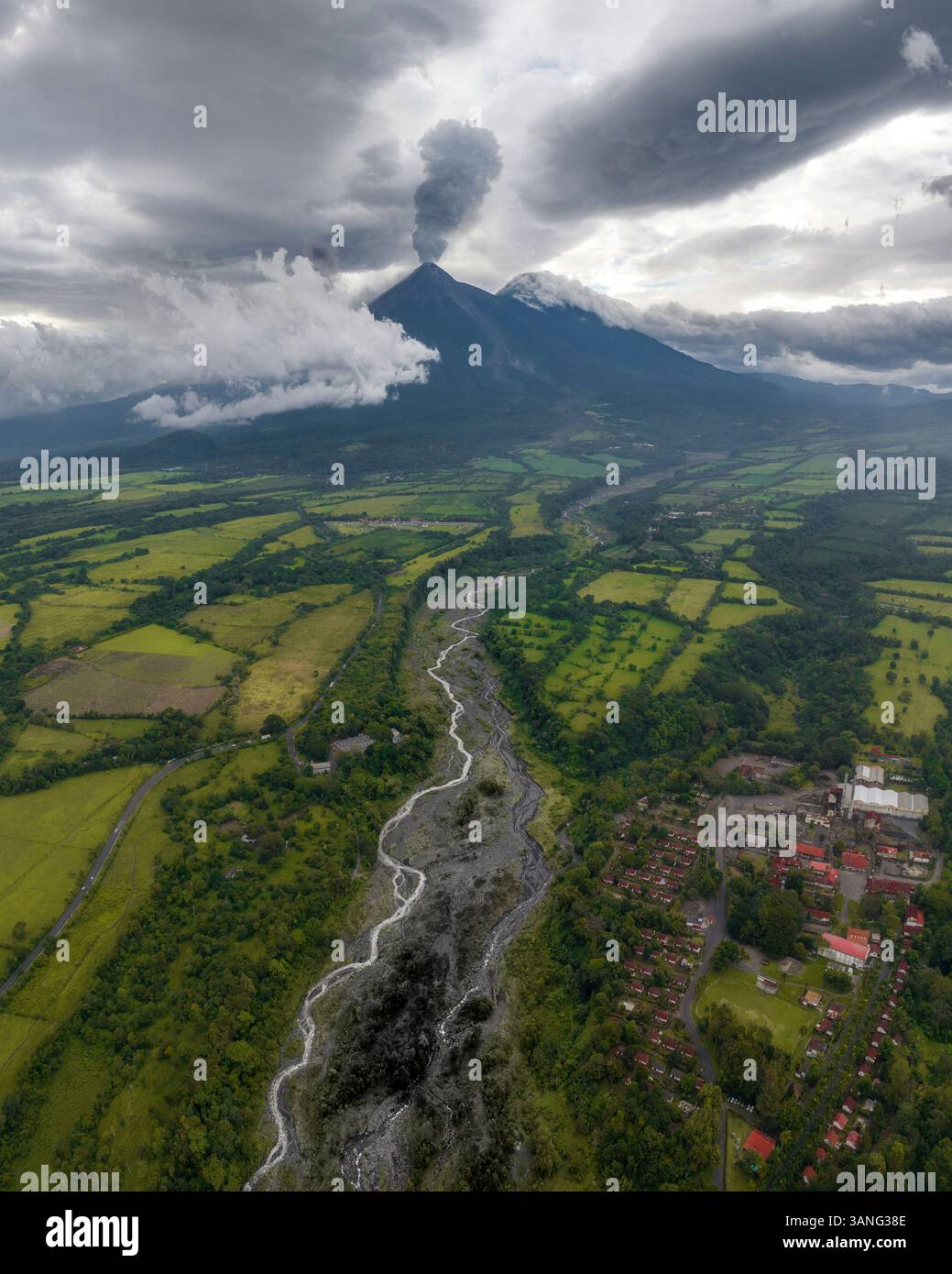 Aerial view of the majestic Fuego volcano with lava and rocks alongside ...