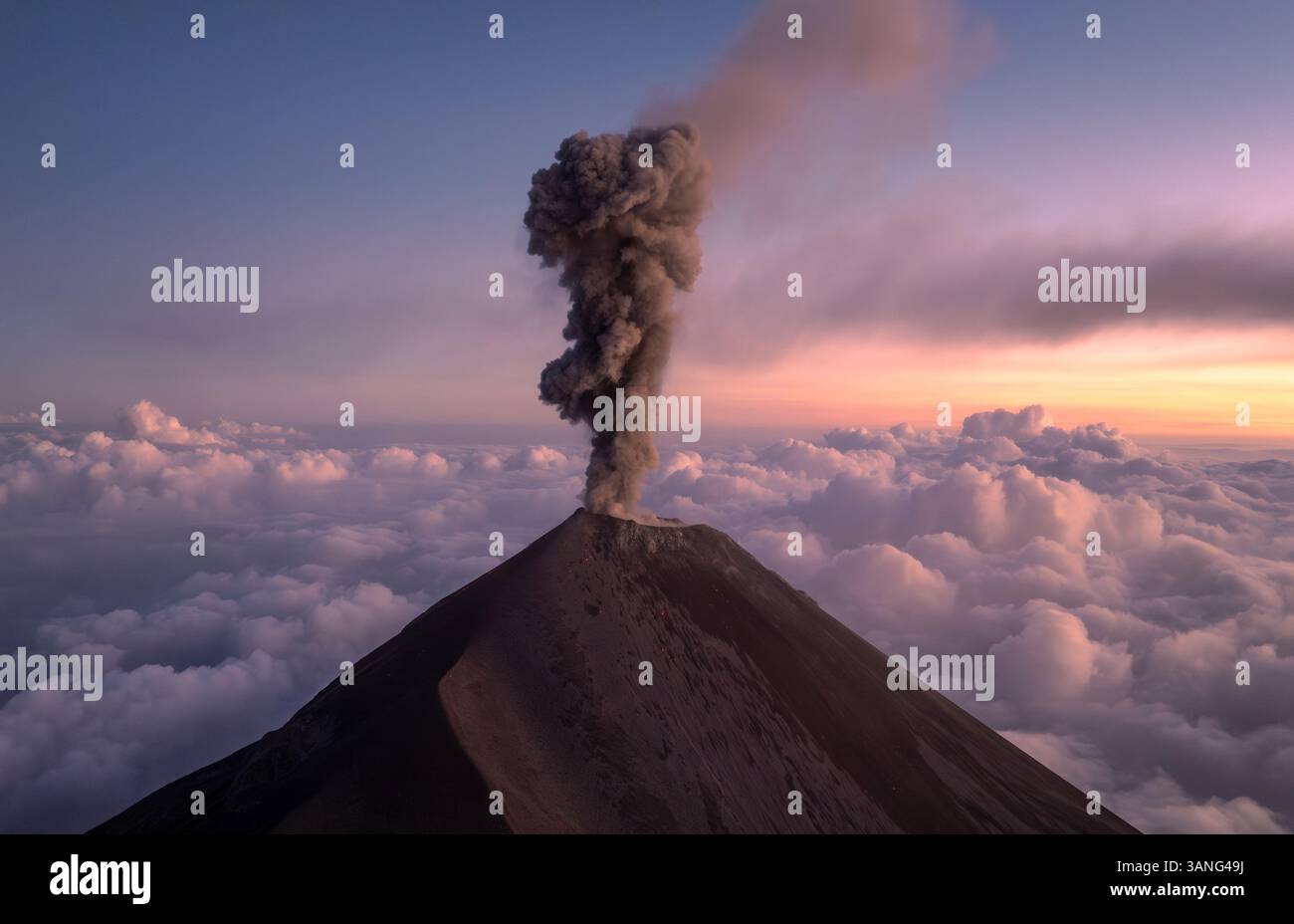 Aerial view of the erupting Fuego volcano with smoke and explosion ...