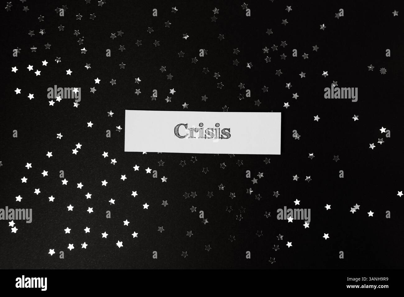 Black background with a white word Crisis written on it. The word ...