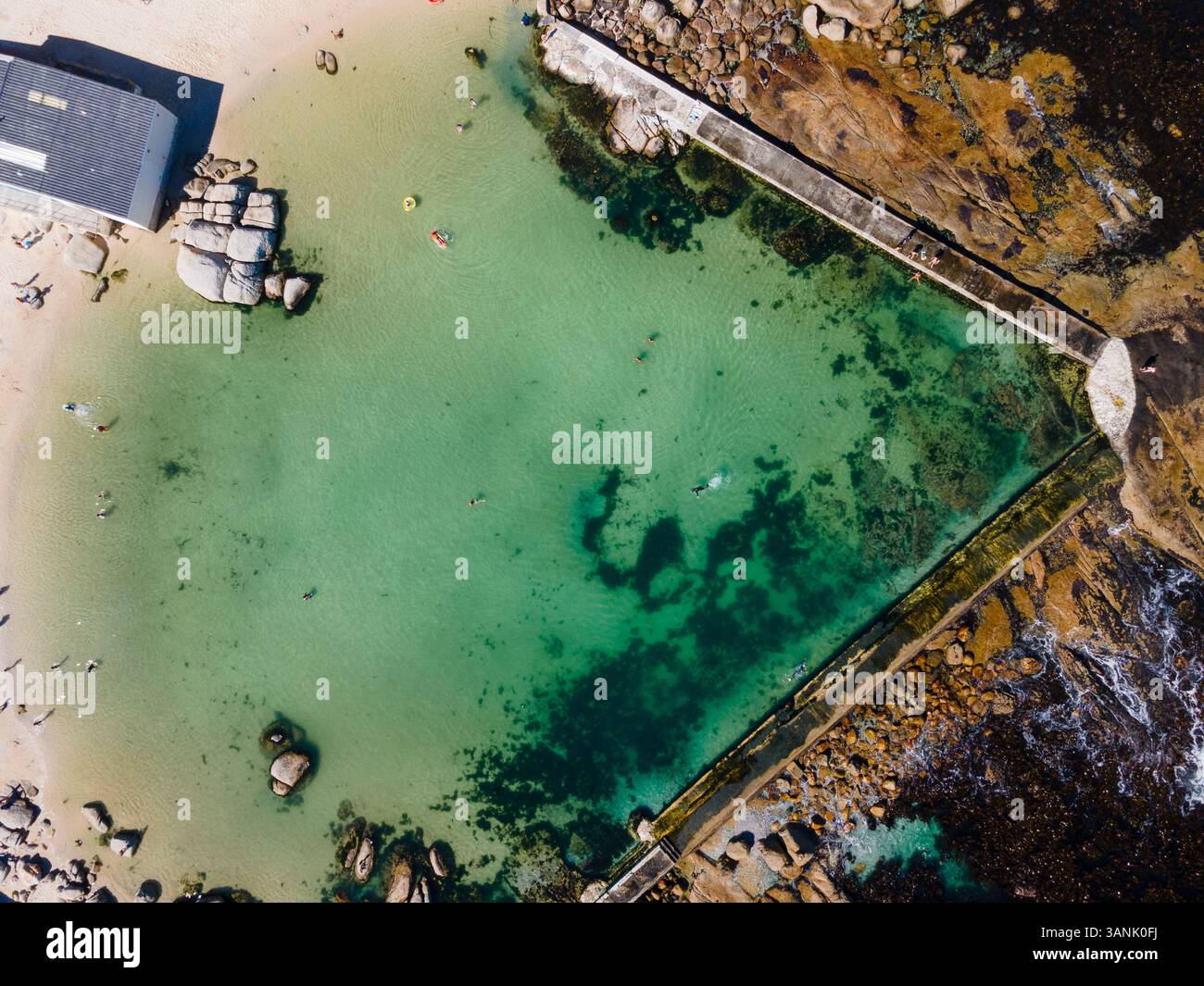 Aerial view of people relaxing at Camps Bay, a tidal pool near Twelve Apostles and Lions Head, Victoria Road, Oudekraal, Cape Town, South Africa. Stock Photo