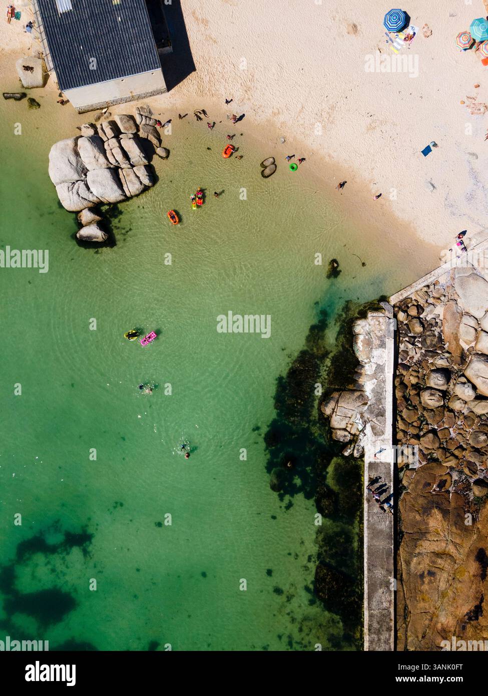 Aerial view of people relaxing at Camps Bay, a tidal pool near Twelve Apostles and Lions Head, Victoria Road, Oudekraal, Cape Town, South Africa. Stock Photo