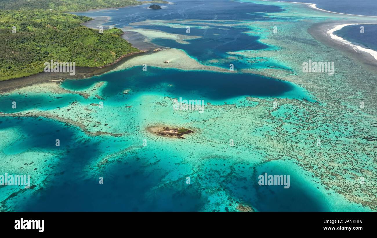 Aerial view of tropical island with coral reef and turquoise ocean ...