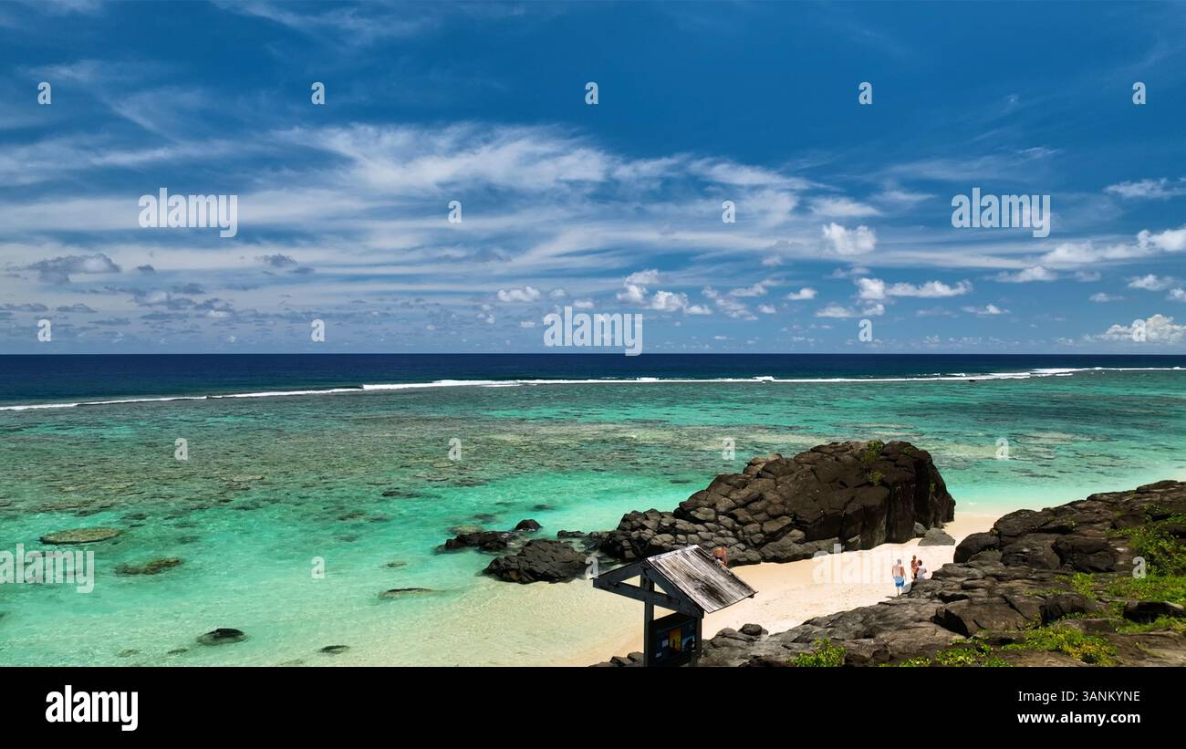 Aerial view of beautiful tropical beach with clear water and rock ...