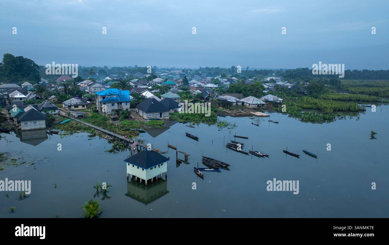Aerial view of a serene waterside village with beautiful homes and boats  amidst tranquil wetlands, Opobo, Nigeria Stock Photo - Alamy, image size:1300x820