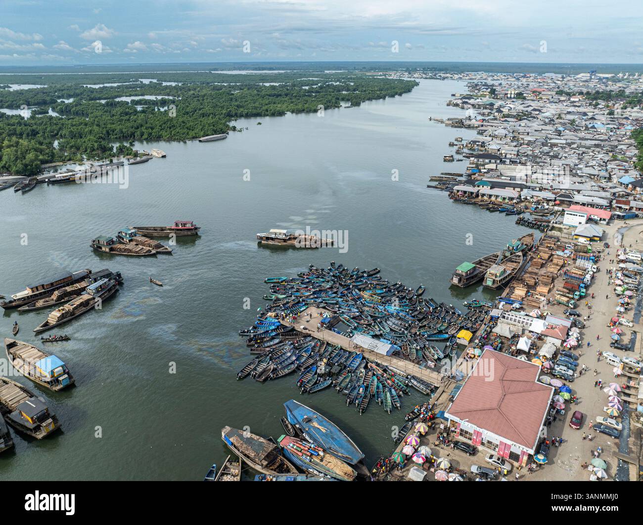 Aerial View Of Clustered Boats At The Waterfront In A Vibrant Cityscape aerial-view-of-clustered-boats-at-the-waterfront-in-a-vibrant-cityscape