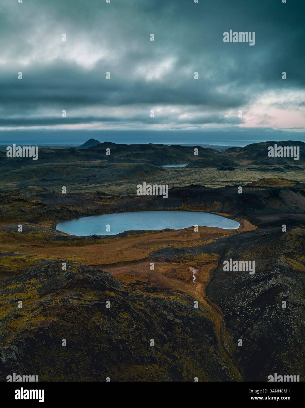 Aerial view of small lake in the mountains of Reykjanes Peninsula in ...