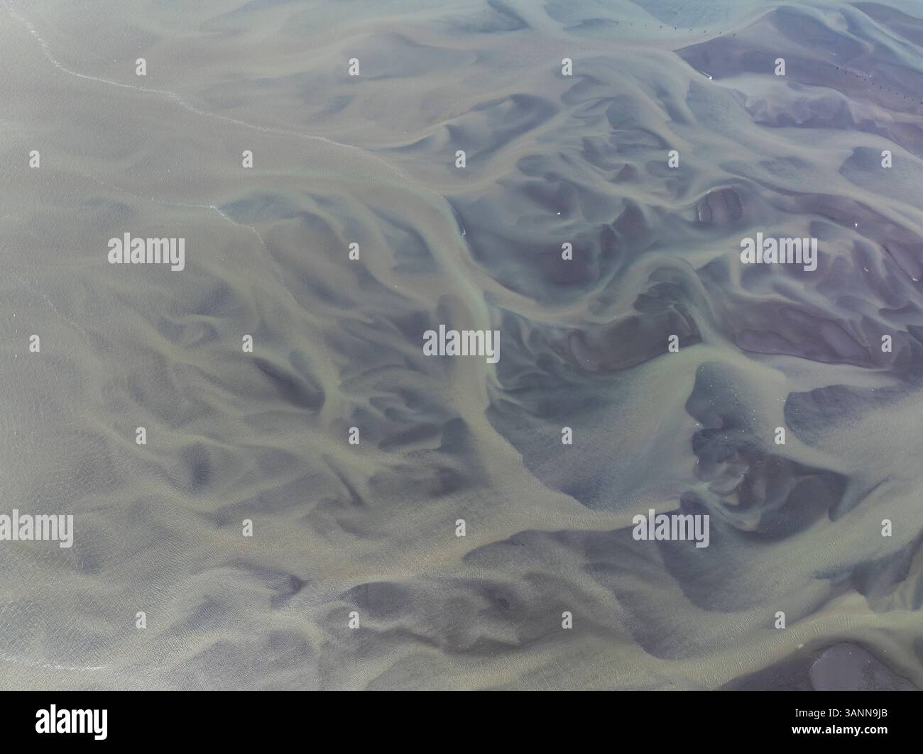 Aerial view of beautiful patterns in a scenic river surrounded by wild landscapes and forests, Bellingham, United States. Stock Photo