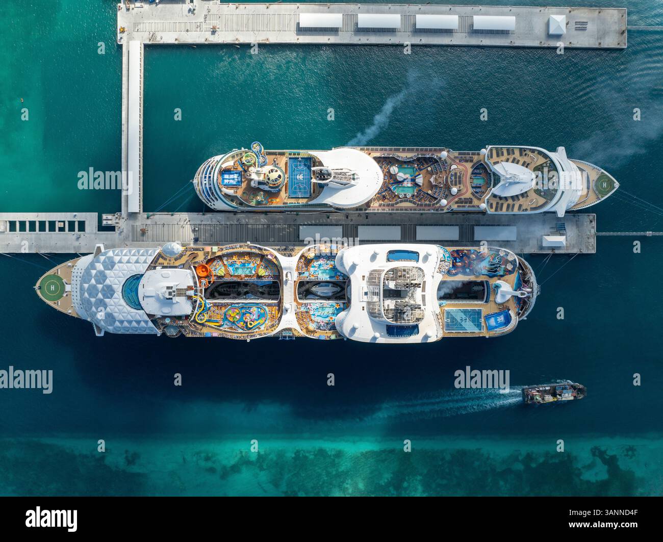 Aerial view of a beautiful cruise ship docked at a luxury harbor with ...