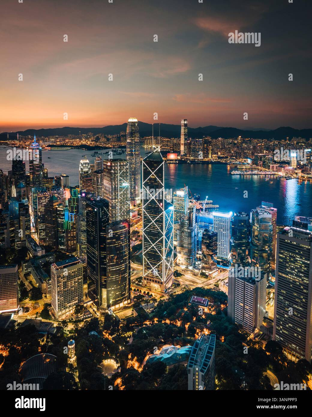 Aerial view of Hong Kong skyline and the financial district at sunset ...