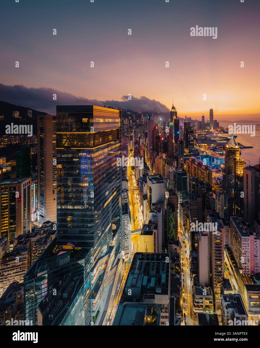 Aerial view of Hong Kong skyline and the financial district at sunset ...