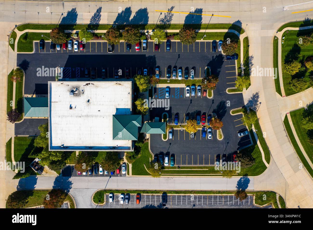 Aerial view of a parking lot busy of vehicles in a small residential ...
