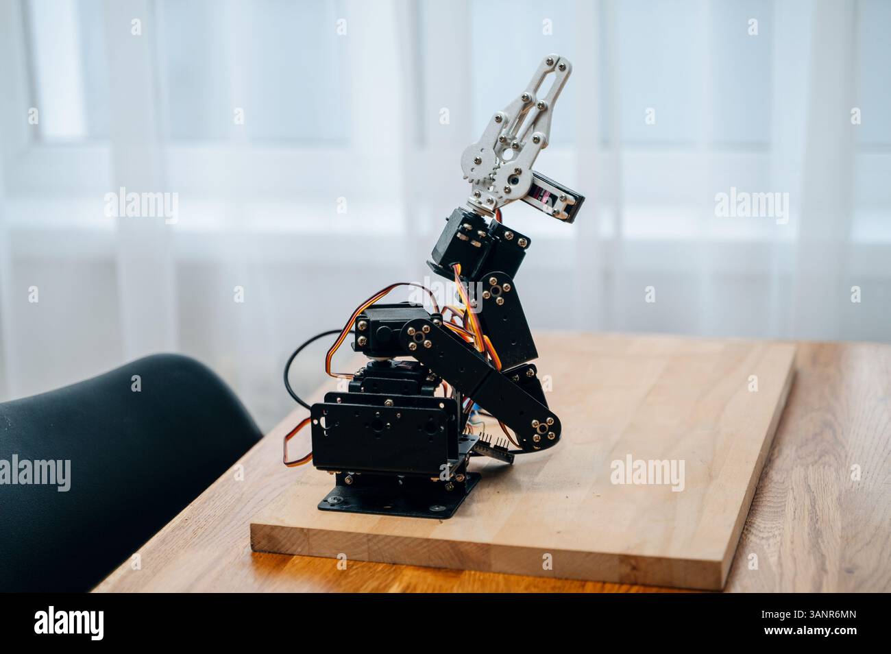 DIY robotic arm with Raspberry Pi and Arduino components Stock Photo