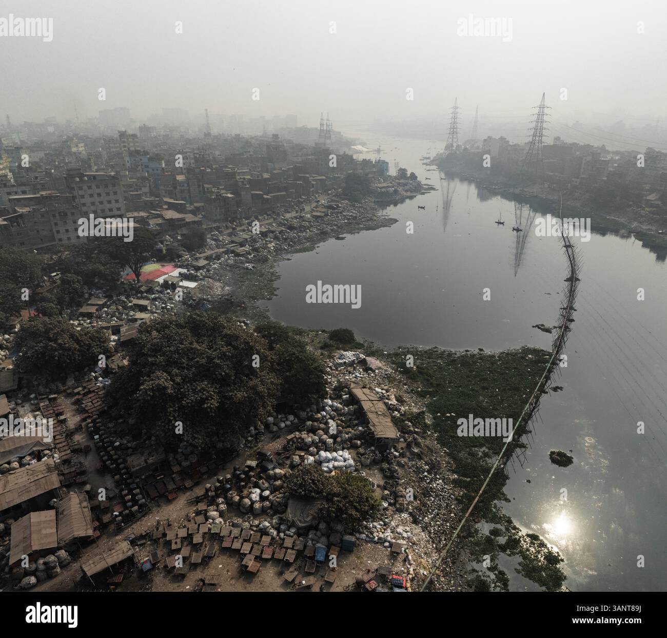 Aerial view of Bagan Bari recycling centre with buildings and river