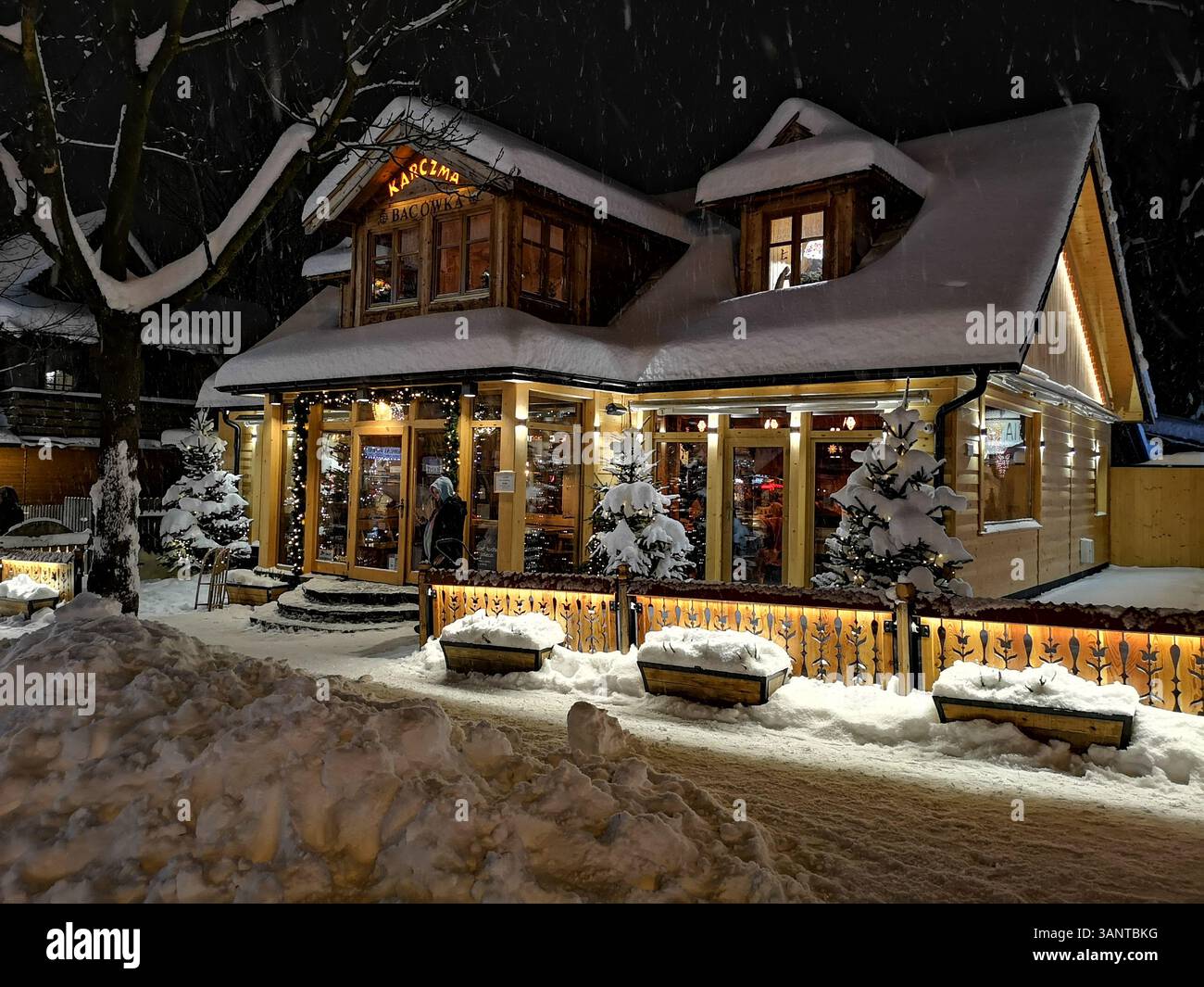 Karczma Bacówka in Zakopane is a picturesque wooden tavern and restaurant. Wooden architecture of Zakopane Krupowki Street southern Poland. - Smartphone Captured Stock Image