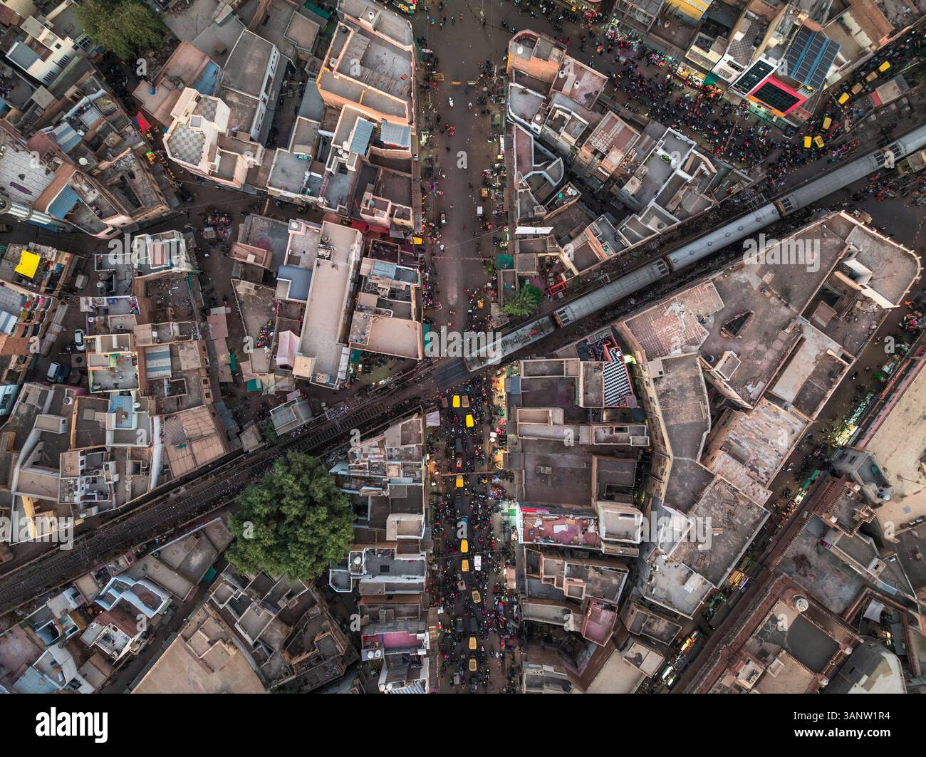 Aerial view of bustling and colorful urban landscape with busy streets ...