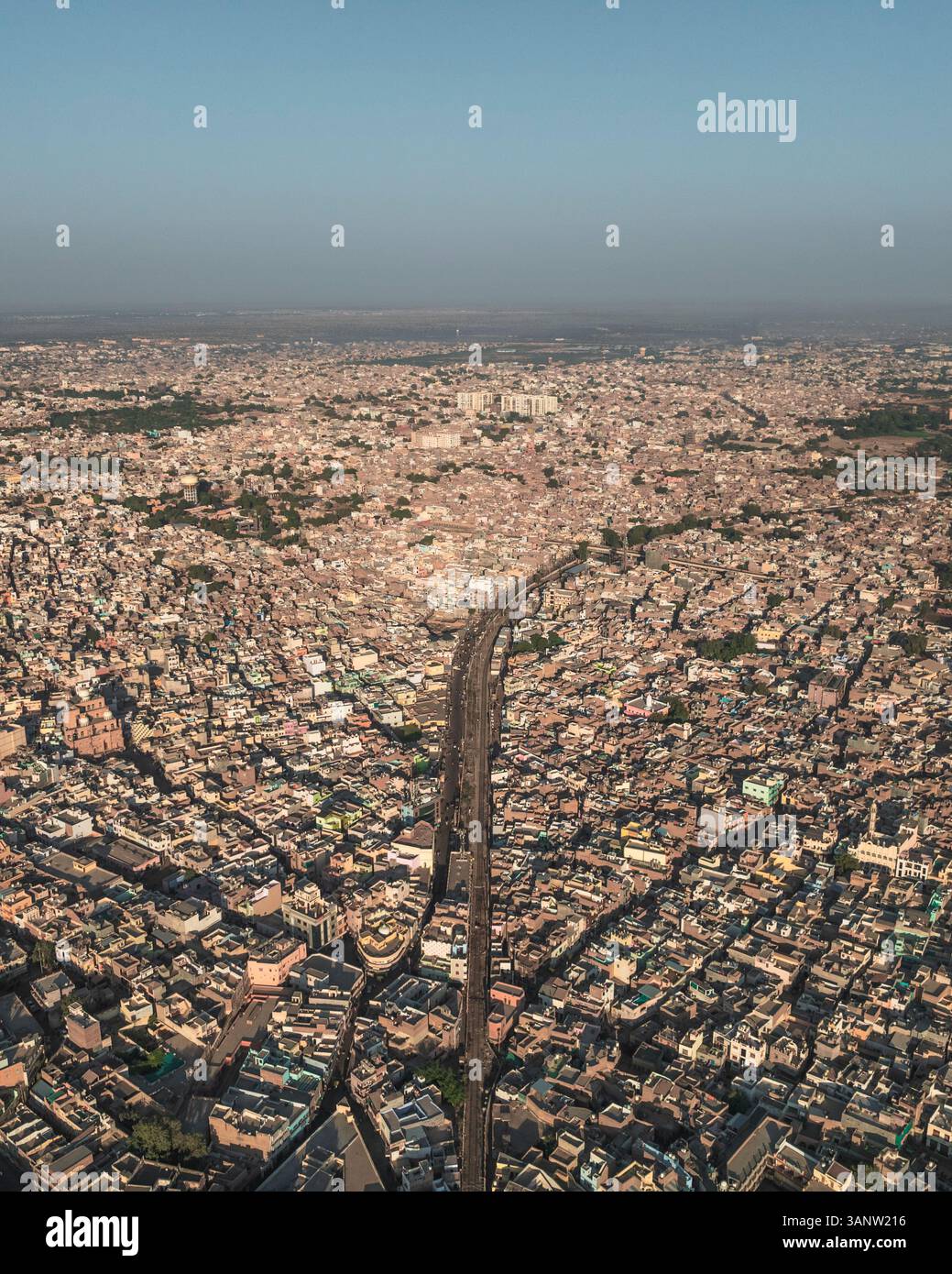 Aerial view of bustling urban landscape with dense buildings and ...
