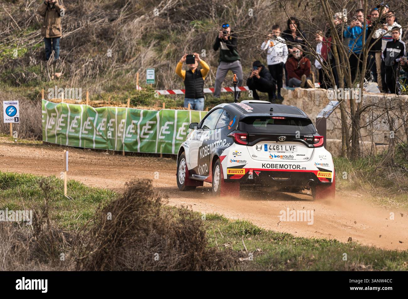 Modern Rally Spectators Madrid, Spain; 02-15-2025: Toyota Yaris rally car braking into a curve ...