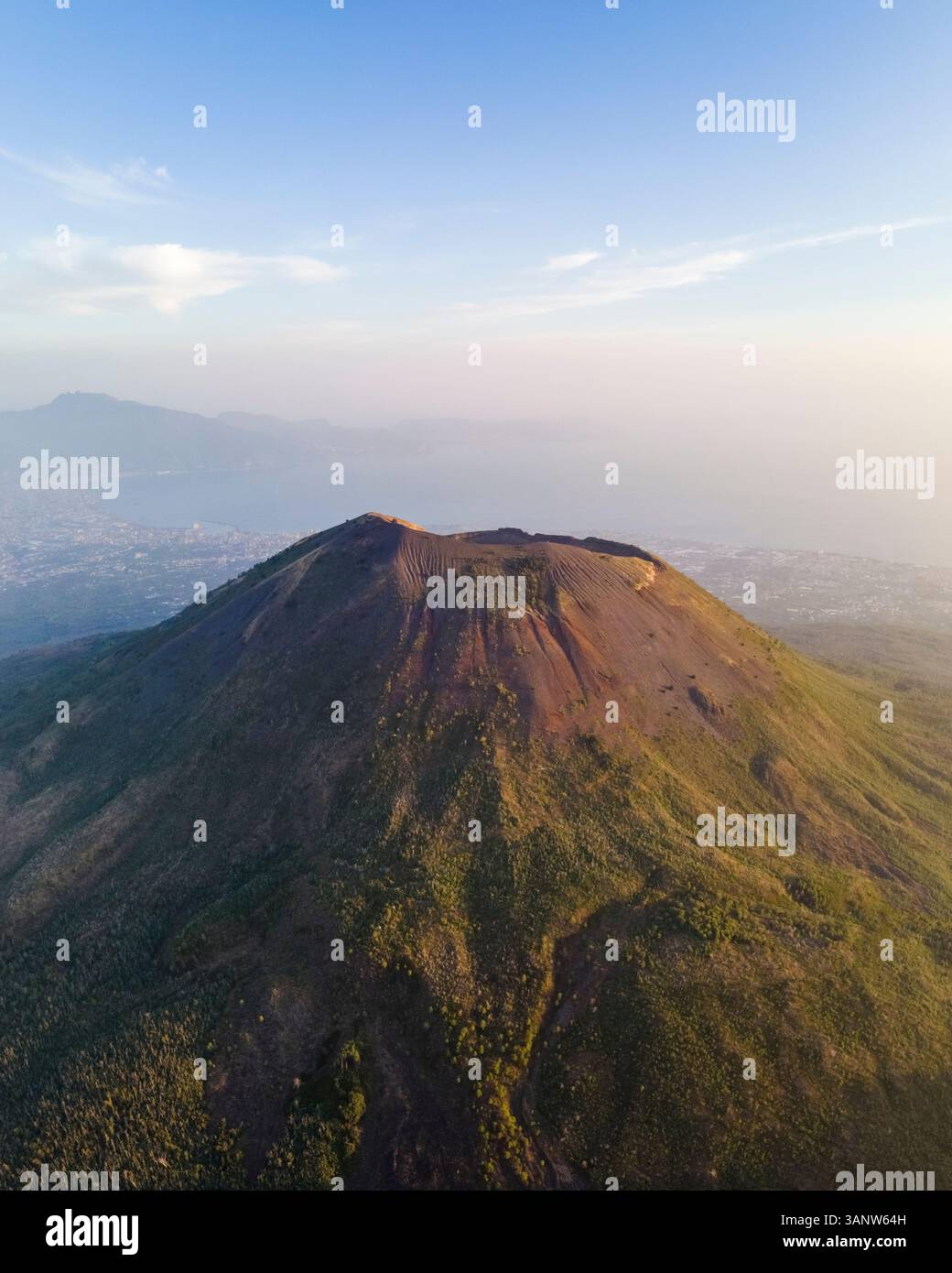 Aerial view of the majestic Mount Vesuvius surrounded by scenic landscapes and clouds, Campania, Italy. Stock Photo