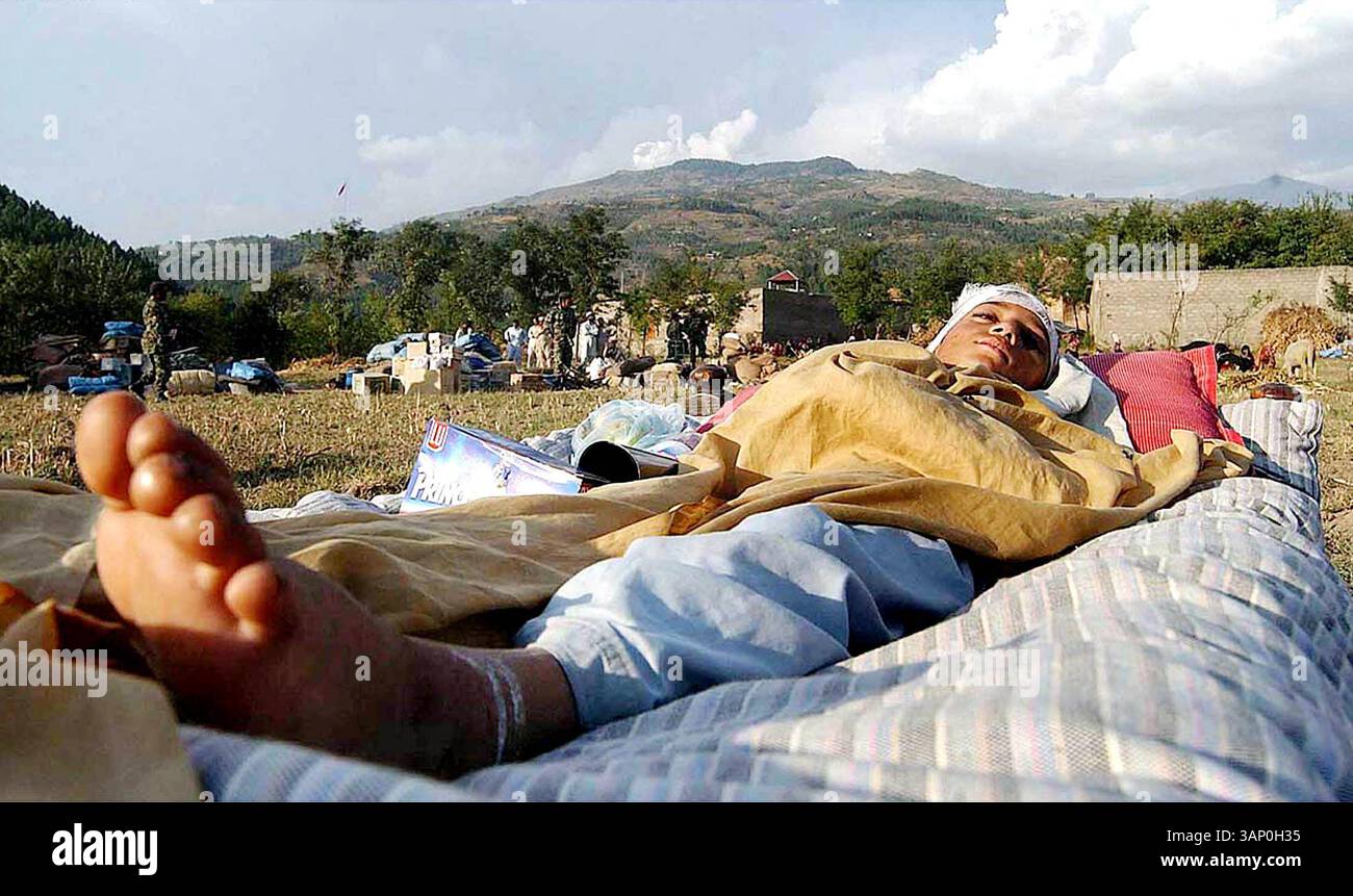 Oct. 17, 2005 - K45560.BUTGRAM: Oct12 â€“ An injured victim of earthquake waits for the volunteers to board him in the navy helicopter at a relief camp in Butgram for the further treatment in a hospital of Abbotabad. More than 23000 thousand people are confirmed dead as around 40000 people are injured and more than four million people rendered shelter-less.  . Zahid / PGP / O.MEDIAS /    2005(Credit Image: © Globe Photos/ZUMAPRESS.com) Stock Photo