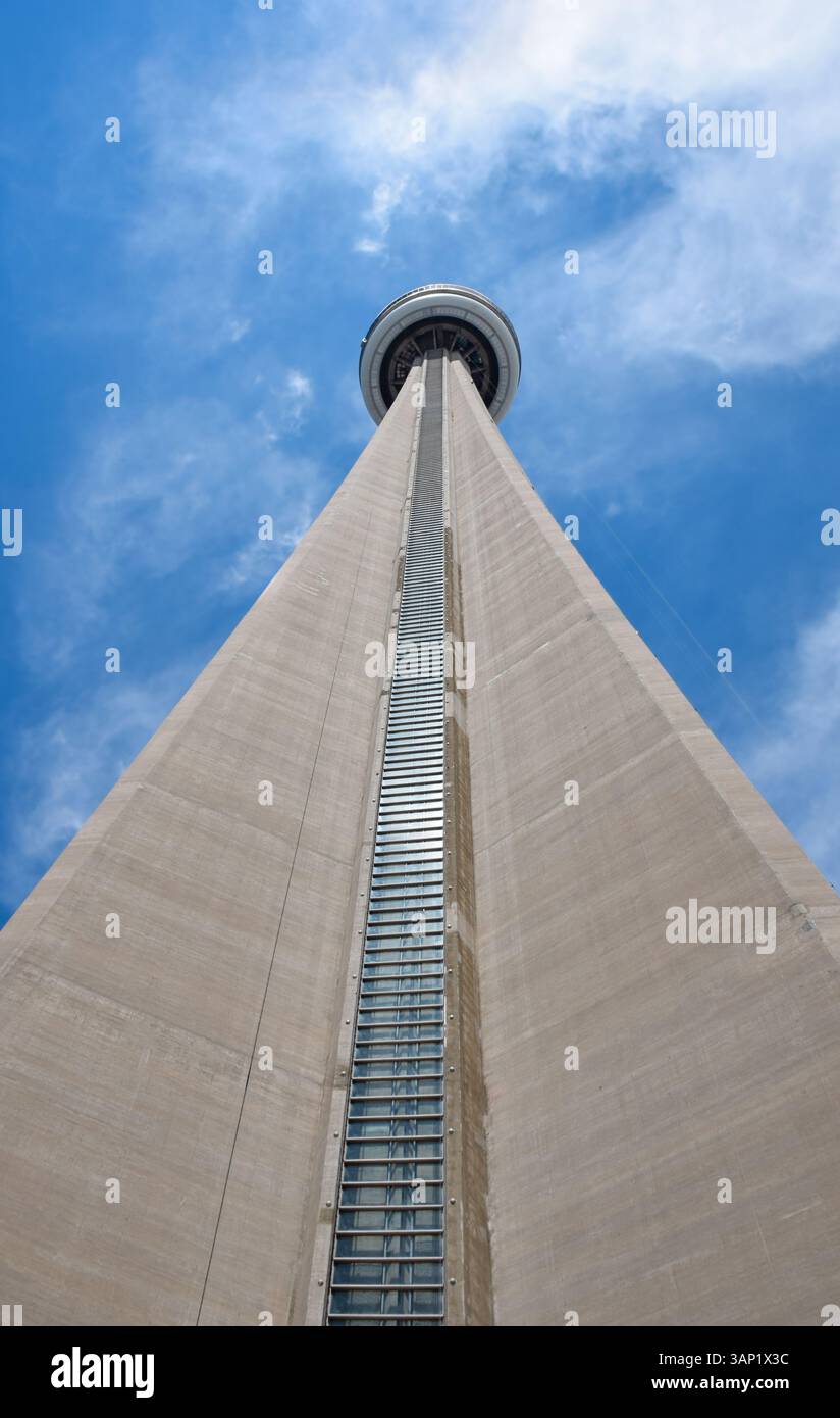 Toronto, Ontario, Canada - July 13, 2014: Looking up at CN Tower and blue sky Stock Photo