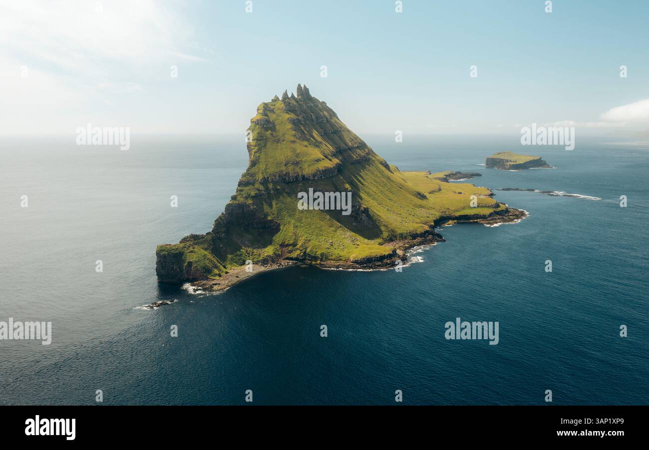 Aerial View Of Tindholmur And Skerholmur Cliffs Overlooking The Serene aerial-view-of-tindholmur-and-skerholmur-cliffs-overlooking-the-serene