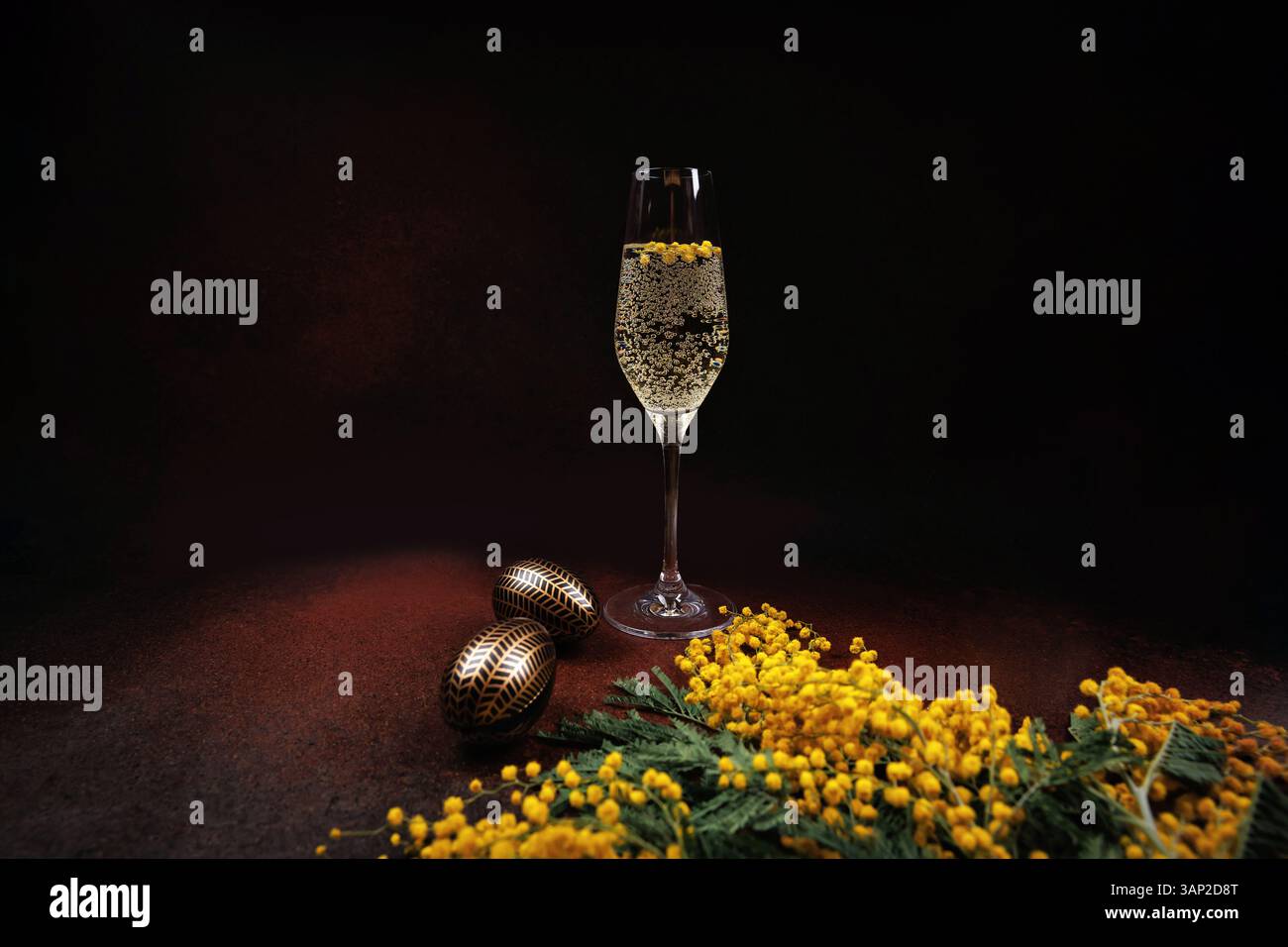 Elegant Easter composition with champagne and mimosa Stock Photo