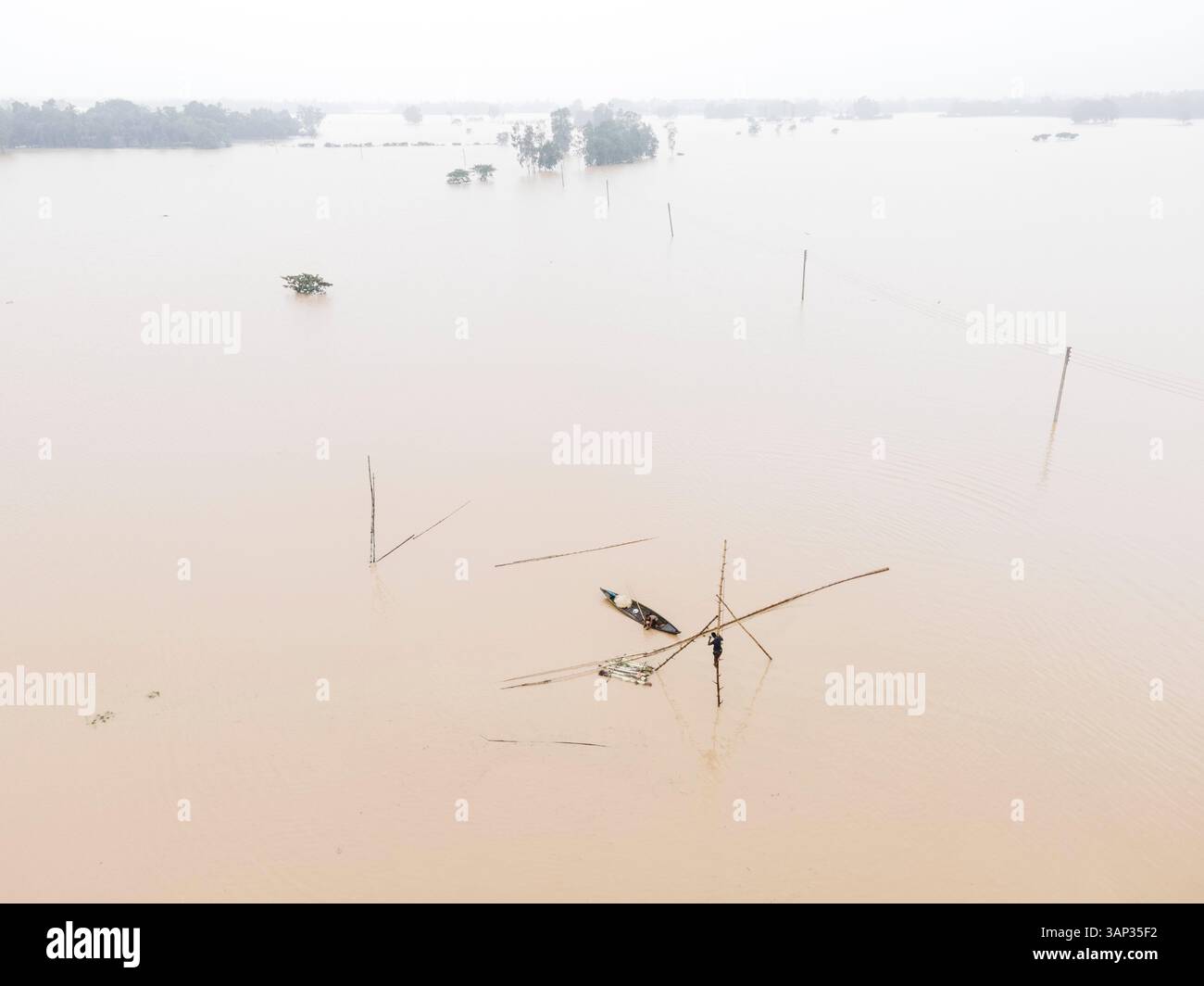 Aerial view of flooded village with submerged houses and overflowing ...