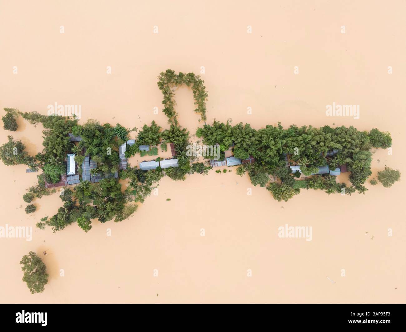 Aerial view of a flooded village with submerged houses and waterlogged ...