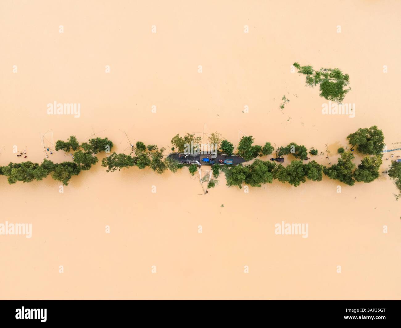 Aerial view of a flooded village with submerged houses and waterlogged ...