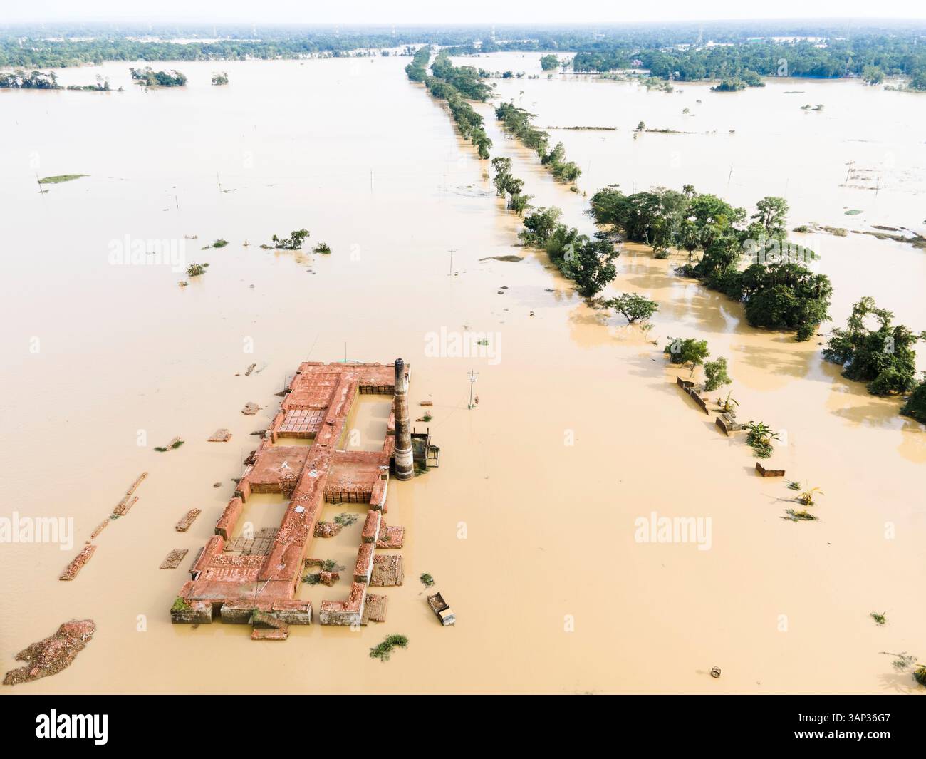 Aerial view of a flooded village with submerged buildings and roads ...