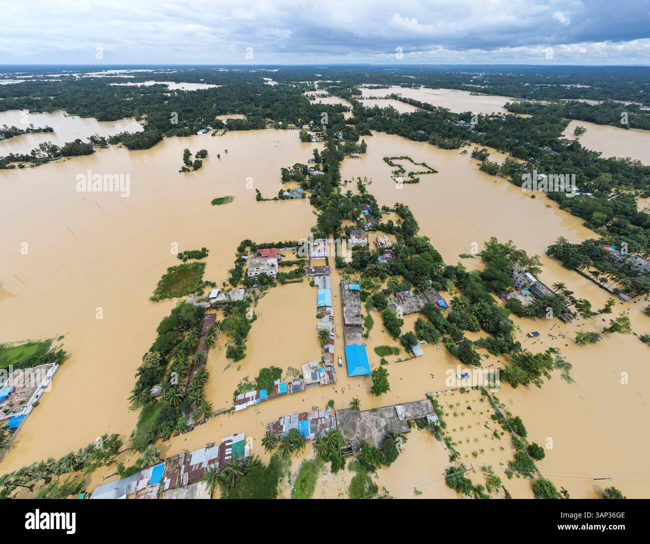 Aerial view of flooded village with submerged homes and waterlogged ...
