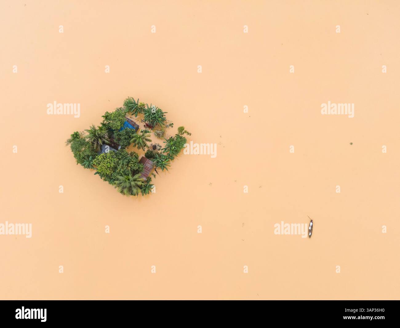 Aerial view of a flooded village with submerged houses and boats ...