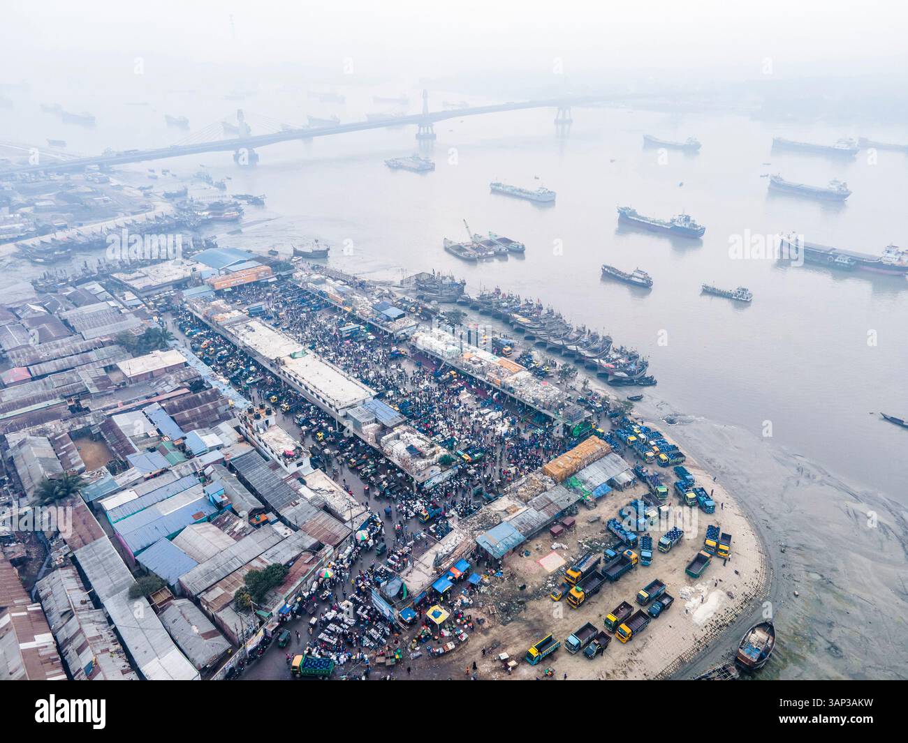 Aerial view of fishing boats on the Karnaphuli river with the Third ...