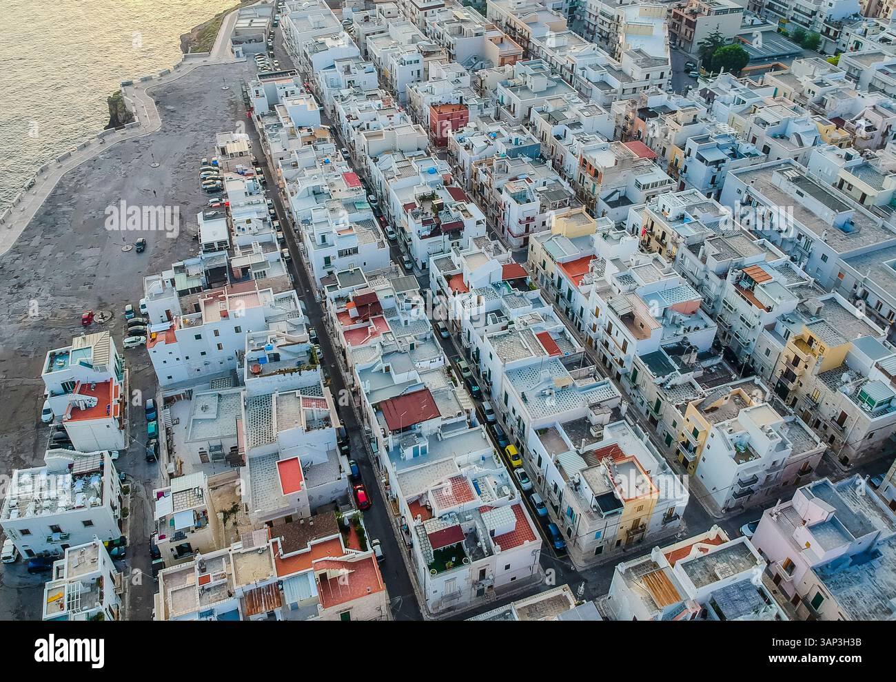 Aerial view of Polignano al Mare, a small town with white houses along ...