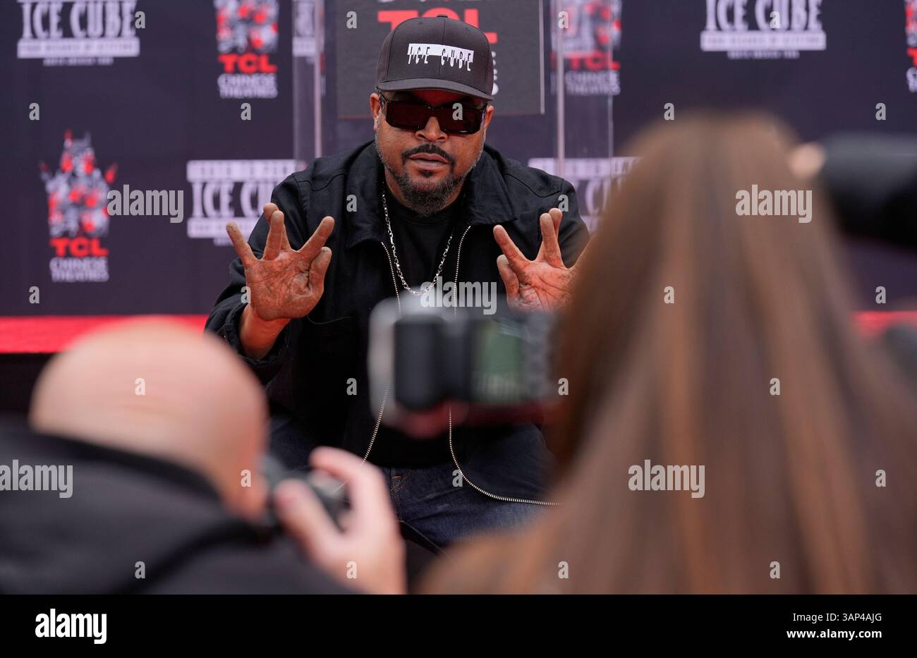 Ice Cube Rapper Hand Sign Ice Cube shows off his hands for photographers after putting them in ...