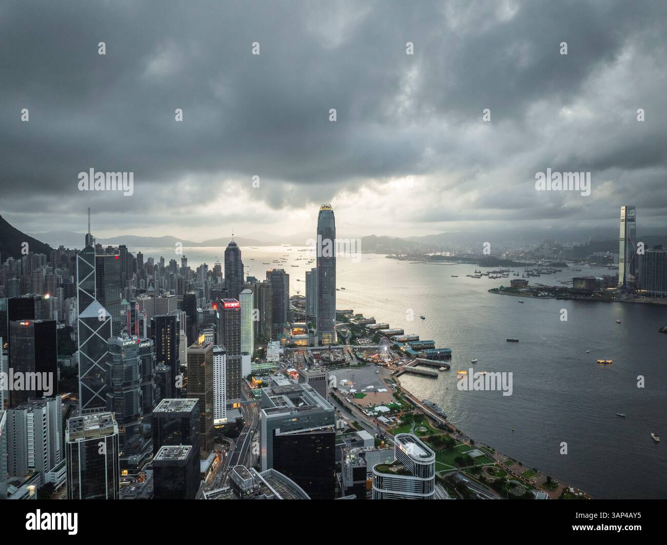 Aerial view of breathtaking skyscrapers and harbor under a cloudy sky ...