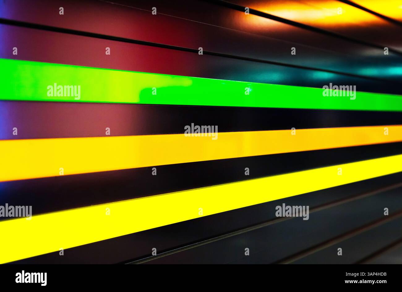 Black ribbed wall with multi-colored neon stripes Stock Photo - Alamy
