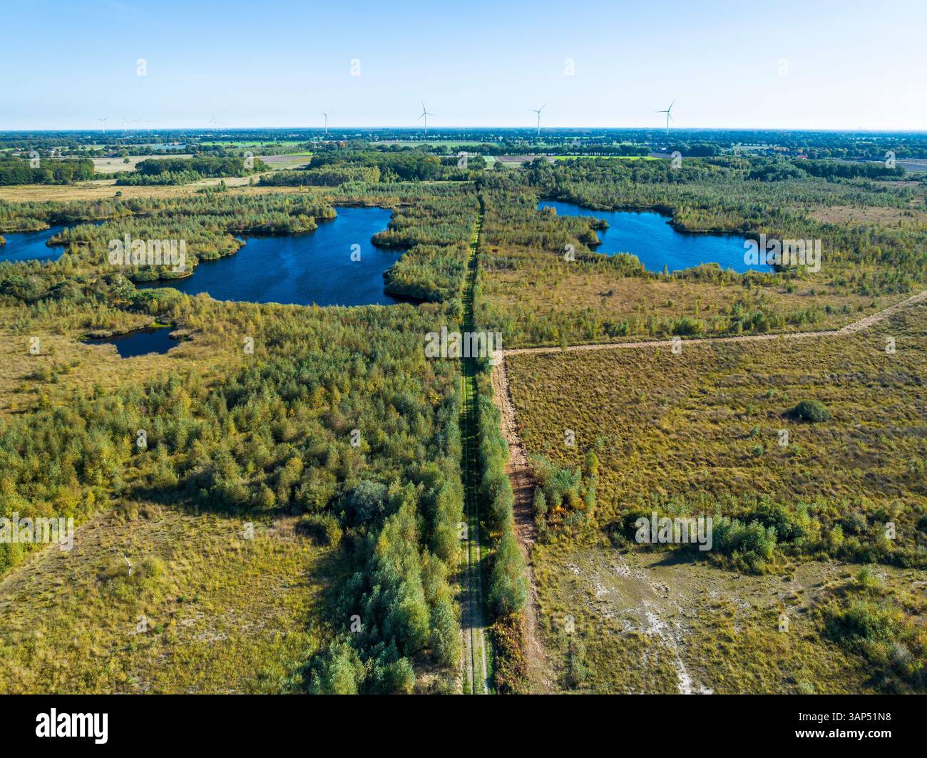 Aerial view of peat bog with lakes, trees and walking path in national ...