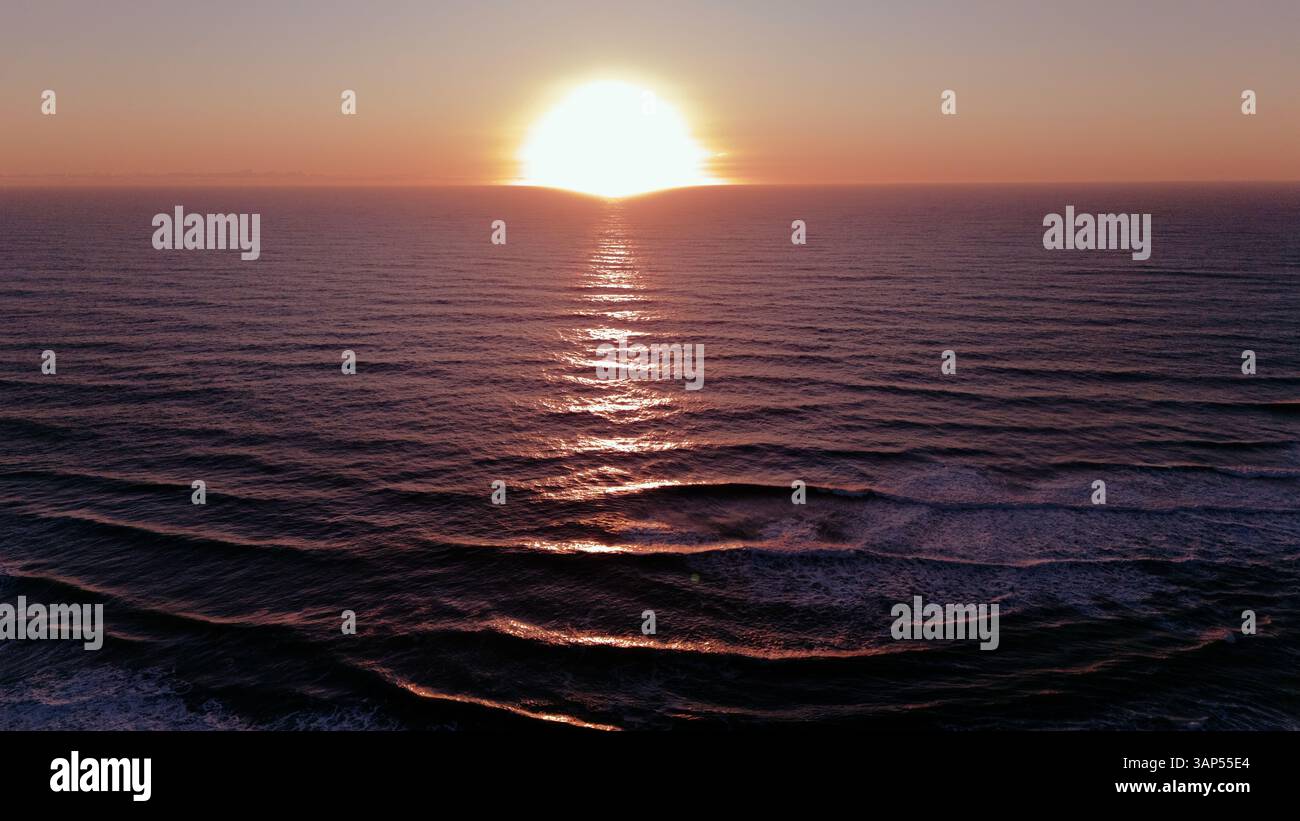Sunset Over Ocean Captured by Drone with Rippling Waves Stock Photo - Alamy