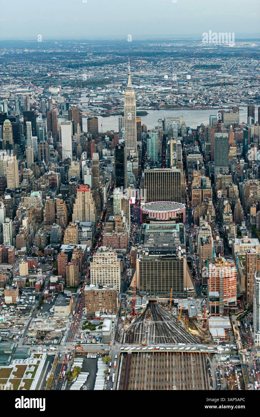 Aerial view of bustling skyscrapers and iconic buildings in a dense ...