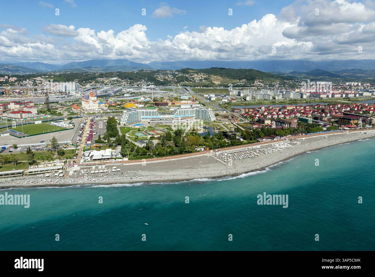 Aerial view of beautiful coastal city of Sochi with beach, sea, and ...
