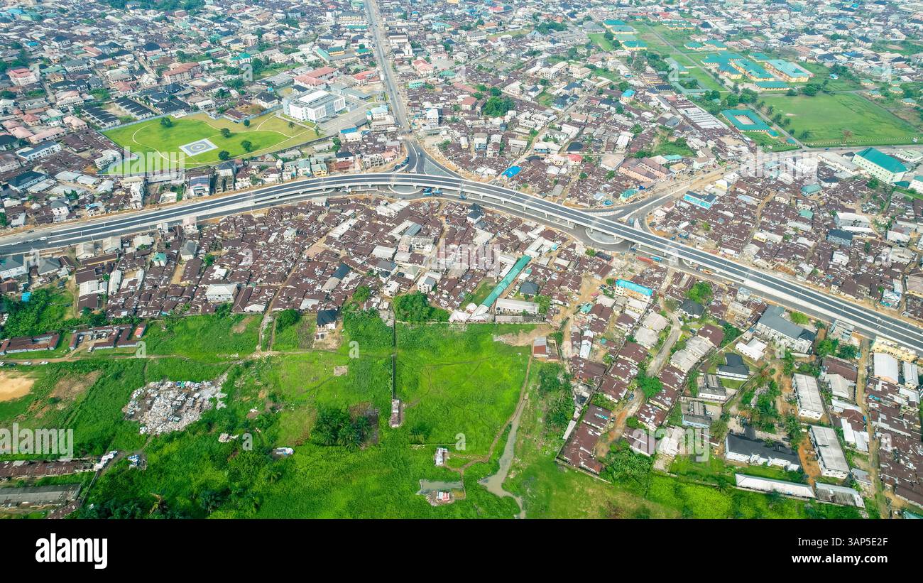 Aerial View Of Overpass Construction Amidst Vibrant Cityscape And aerial-view-of-overpass-construction-amidst-vibrant-cityscape-and