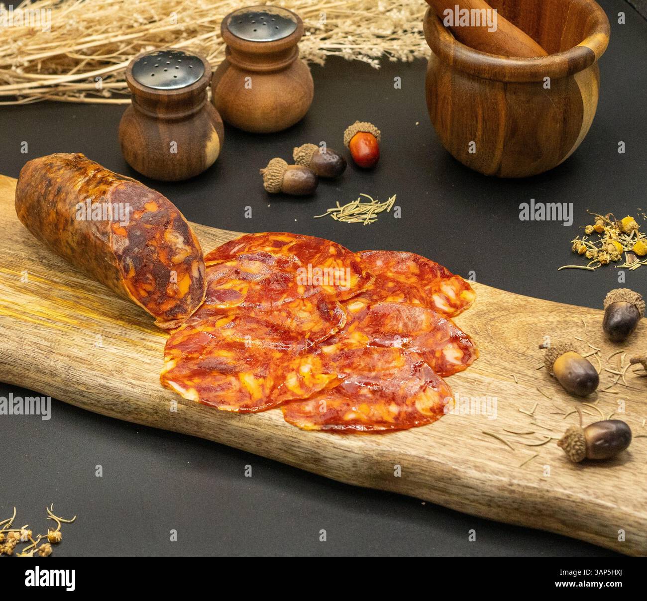 Artisanal Chorizo served with Rustic Serveware and accompanied by Natural Decor elements Stock Photo