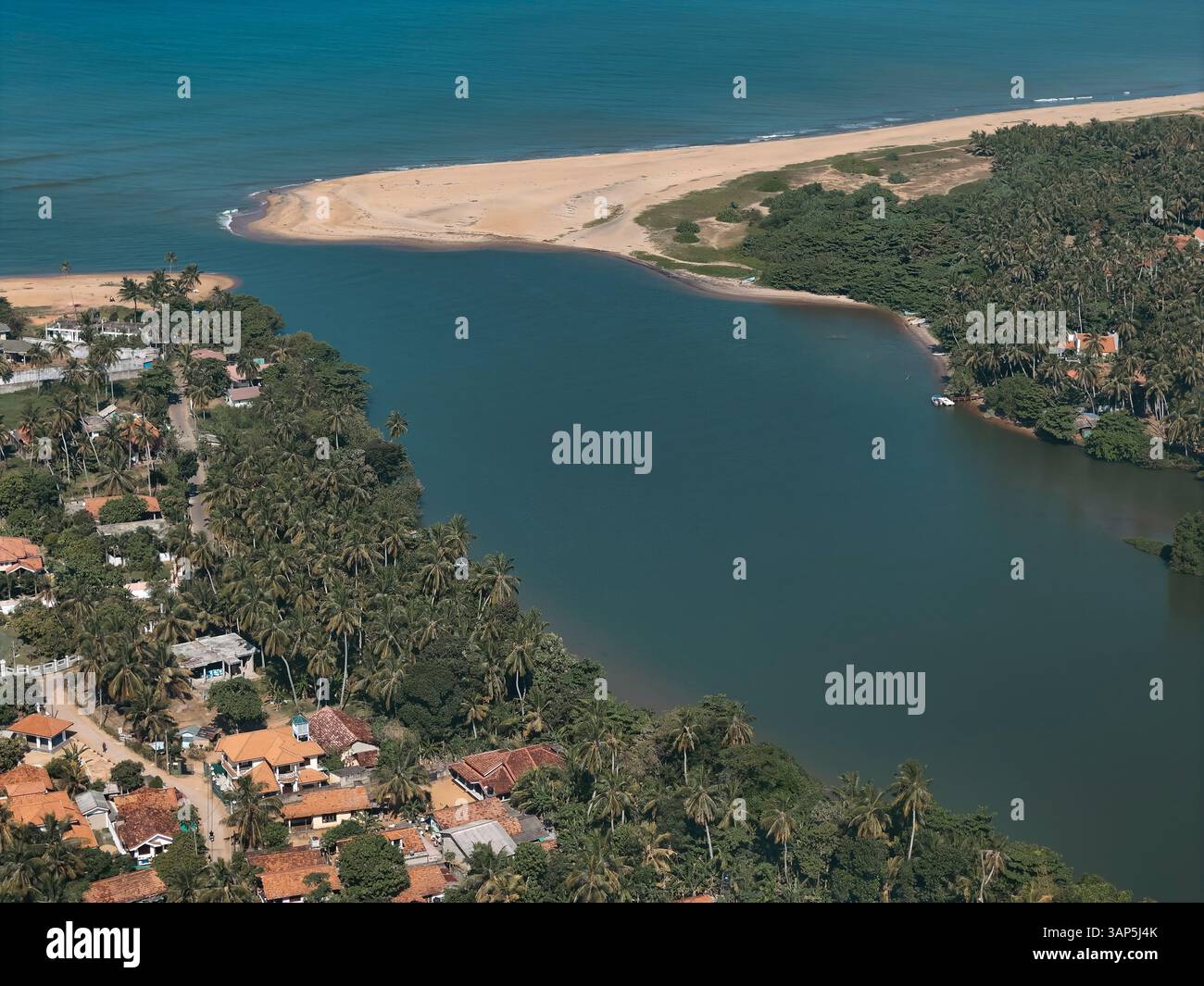 Aerial view of coastal settlement near river Maha Oya and Indian Ocean ...