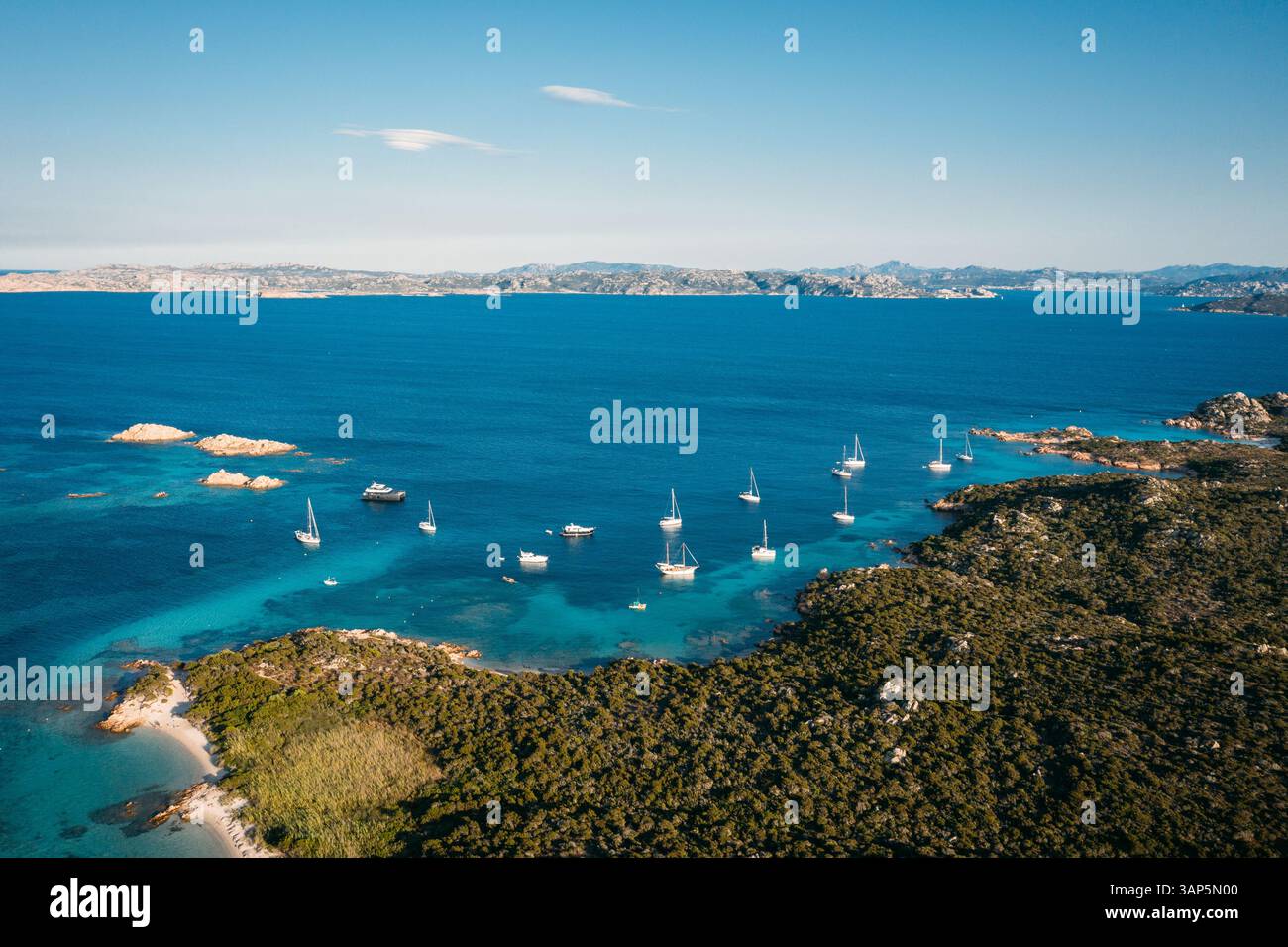 Aerial view of group of boats anchored in the bay of Cala Santa Maria ...